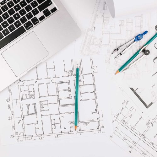 architecture-concept-with-building-plan-laptop