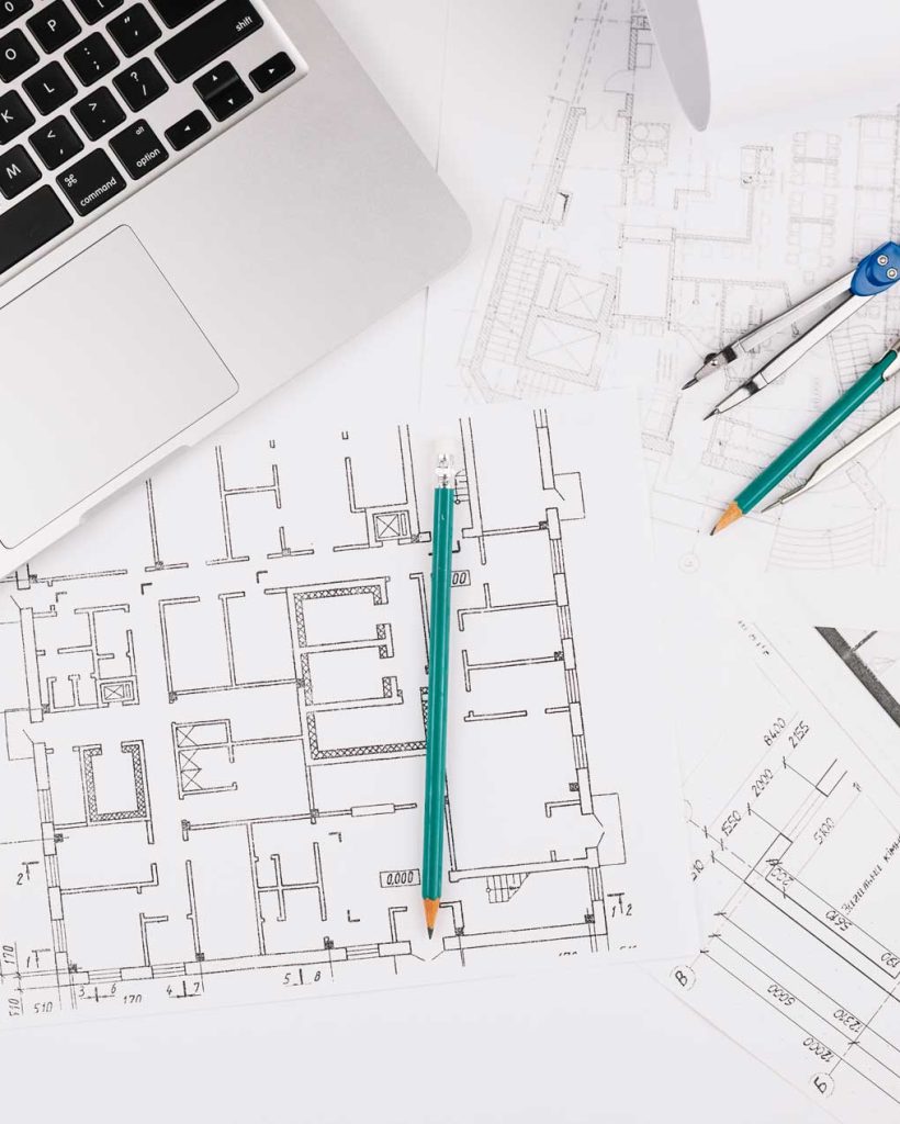 architecture-concept-with-building-plan-laptop